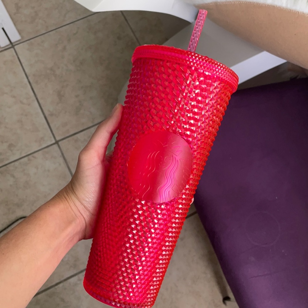 Neon pink studded Starbucks cup